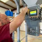 attaching gross weight bagging scale to hopper