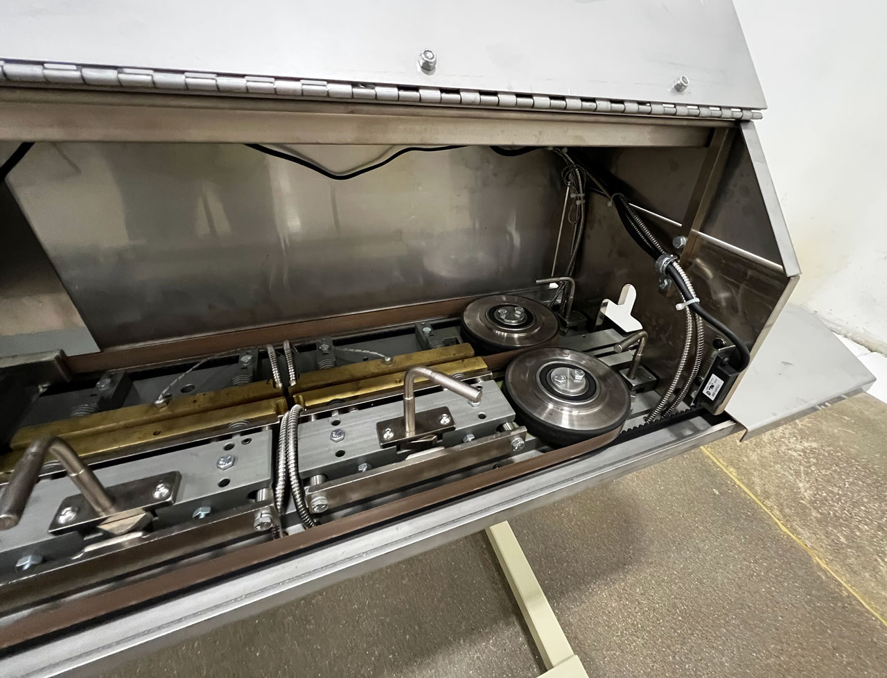 Internal view of continuous bag sealer front bag heat rollers