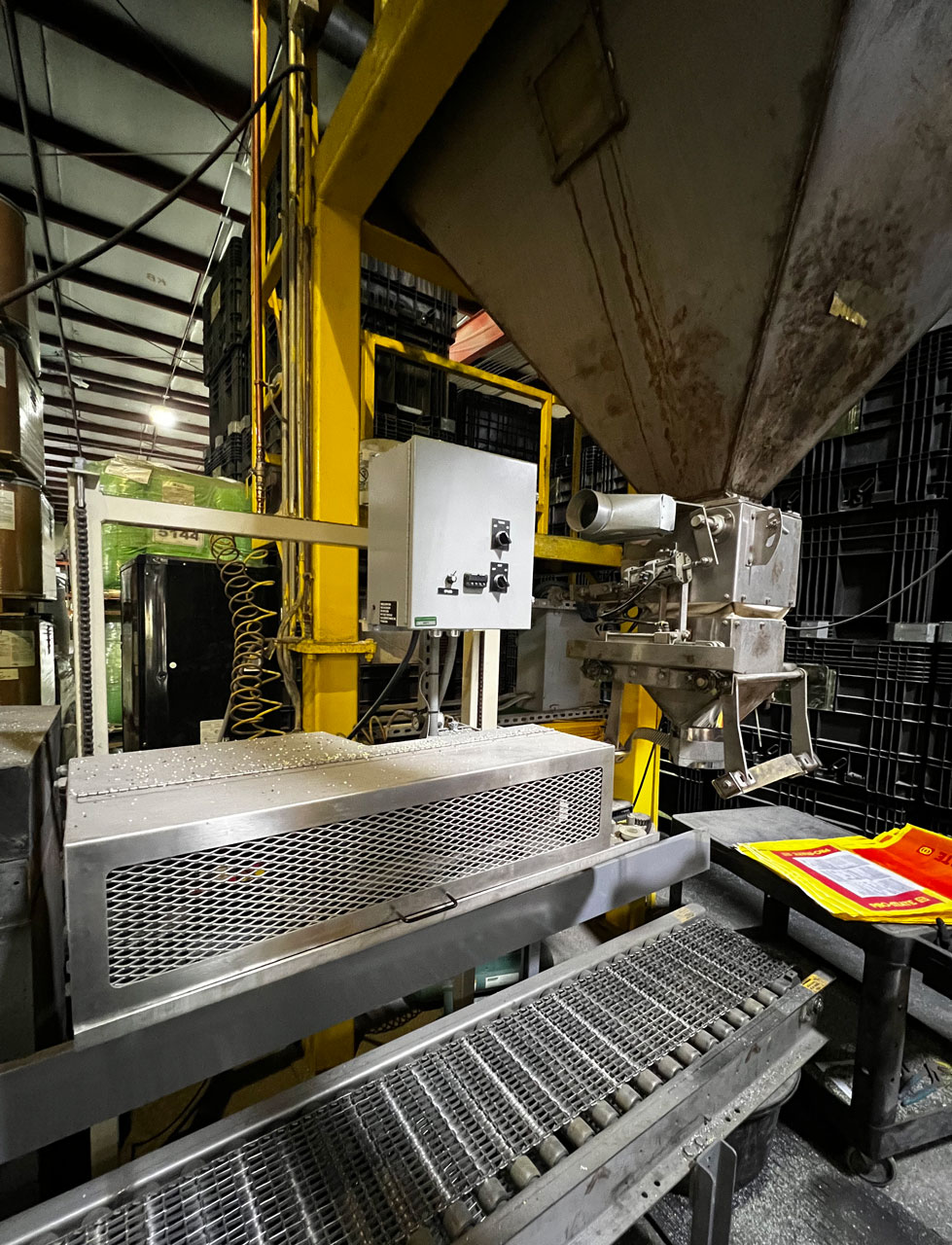 Hot air bag sealer used to seal large poly bags filled with fertilizer