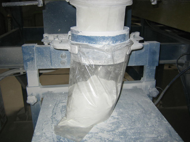 5 pound plastic bag being filled with Titanium Dioxide and Calcium Carbonate