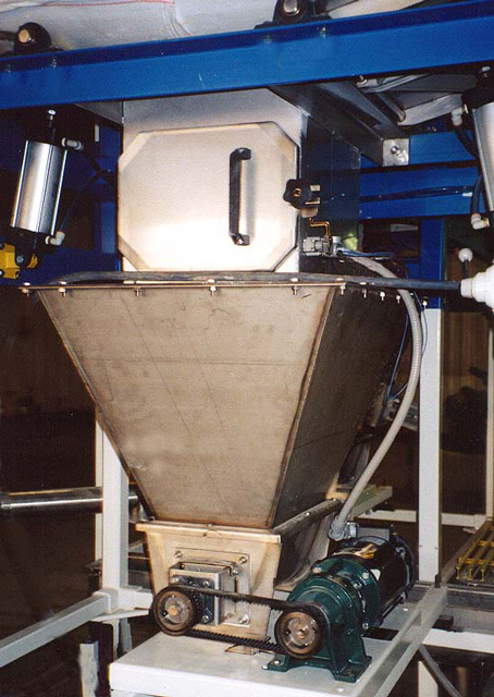 Bulk bags and tote bin unloaded into hopper and then to mixing screw