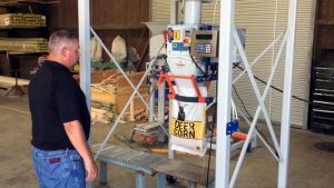 deer corn bagging machine over roller conveyor