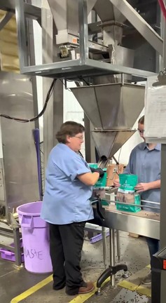 operator at small bag filling machine