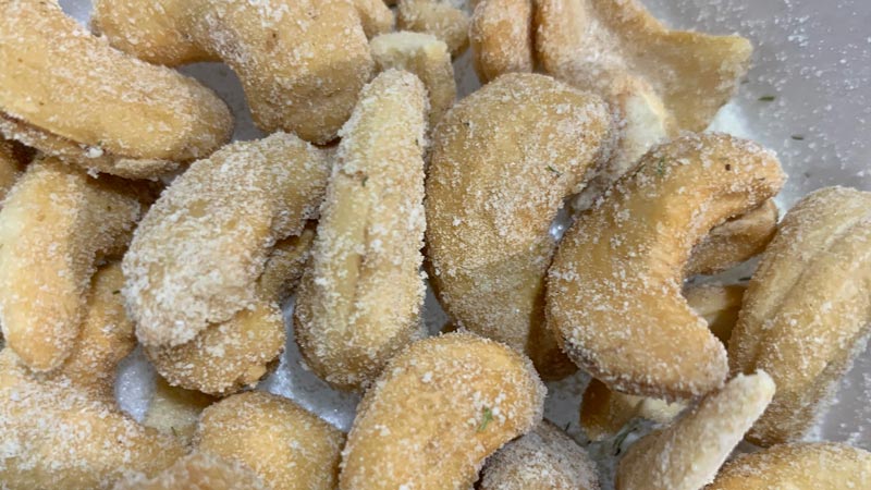 Cashews coated with dill pickle seasoning