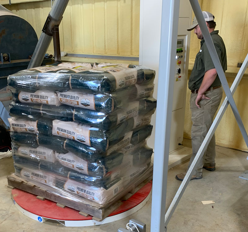 stretch wrapping pallet with bags of corn