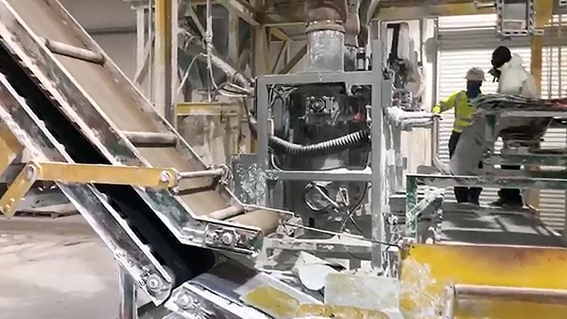 One operator filling 50 lb bags with hydrated lime powder