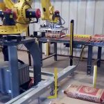 bag palletizing robot picks up and palletizes 50lb bags of creep cattle feed 003