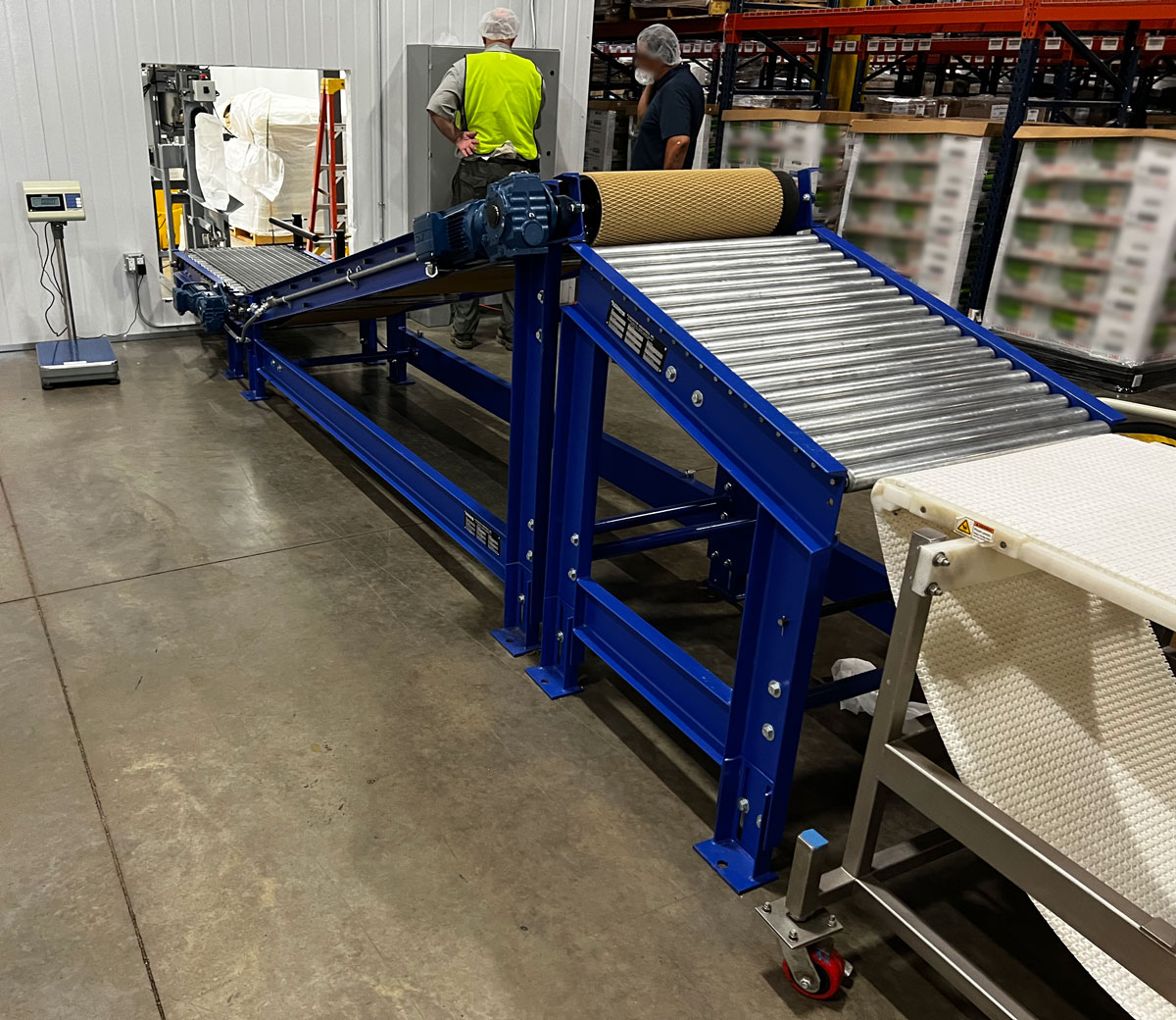 View of valve bagging equipment to discharge, incline, and roller conveyors