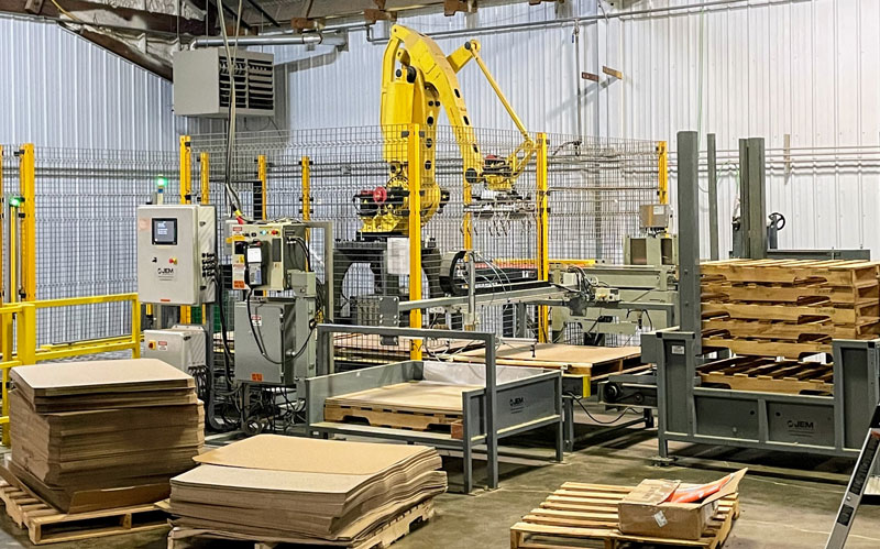 Pallet dispenser and slip sheet dispenser in robotic palletizing system