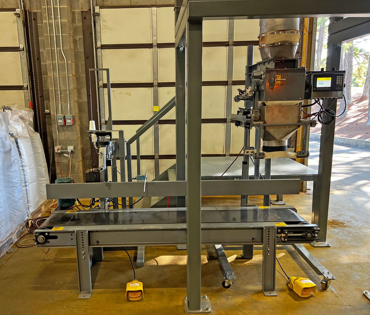 repackaging water filter media from bulk bags into open mouth bags